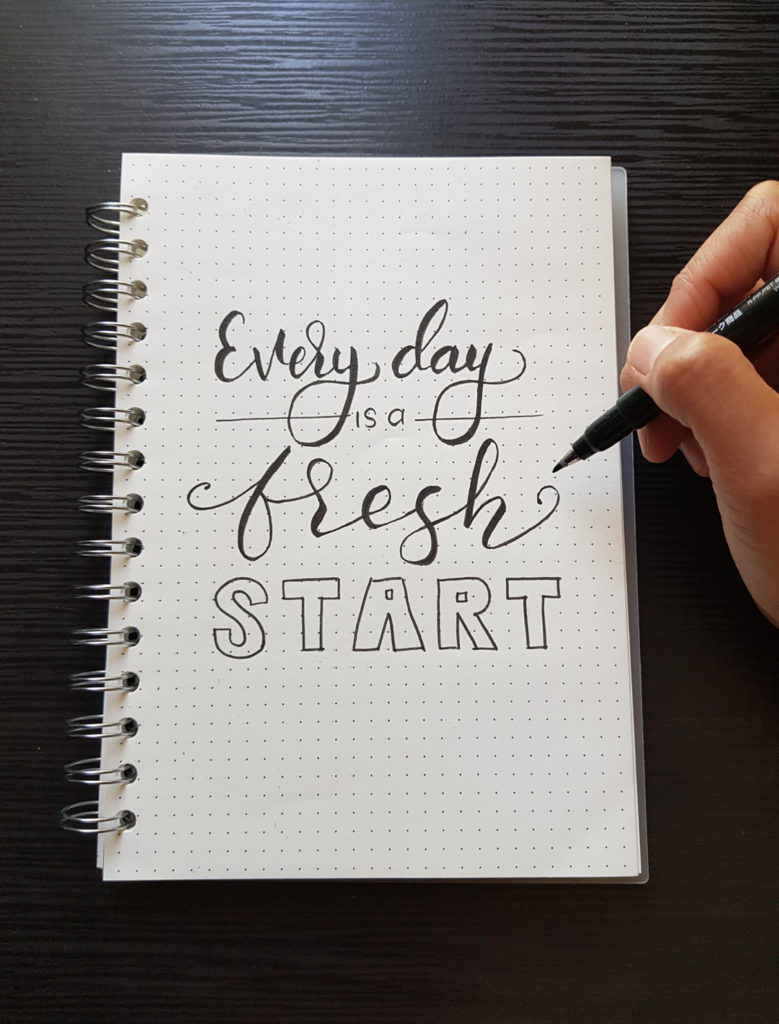 Notebook with Every Day is a Fresh Start written on it 